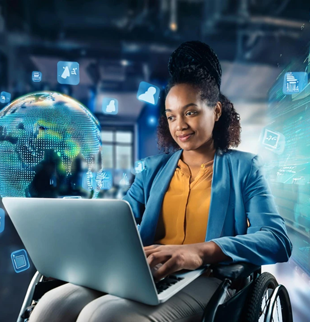 Personne travaillant avec des outils numériques inclusifs dans un environnement professionnel adapté